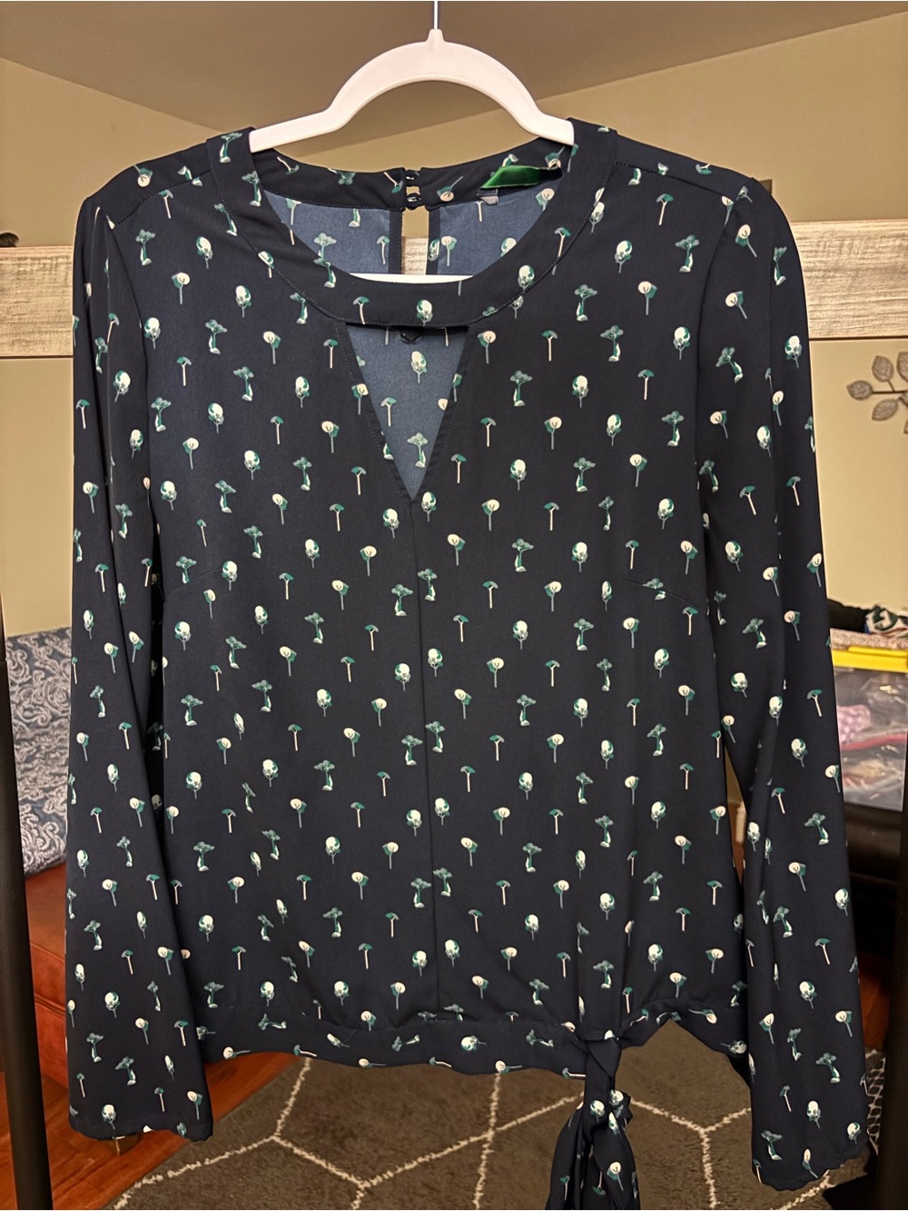 Beautiful Navy Floral Tie-Hem Blouse fits like a Large